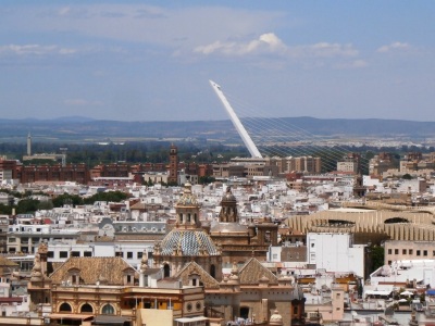 Seville from the Giralda Tower and the Alamilla Bridge's slanted white tower built for Seville's '92 World Expo. 